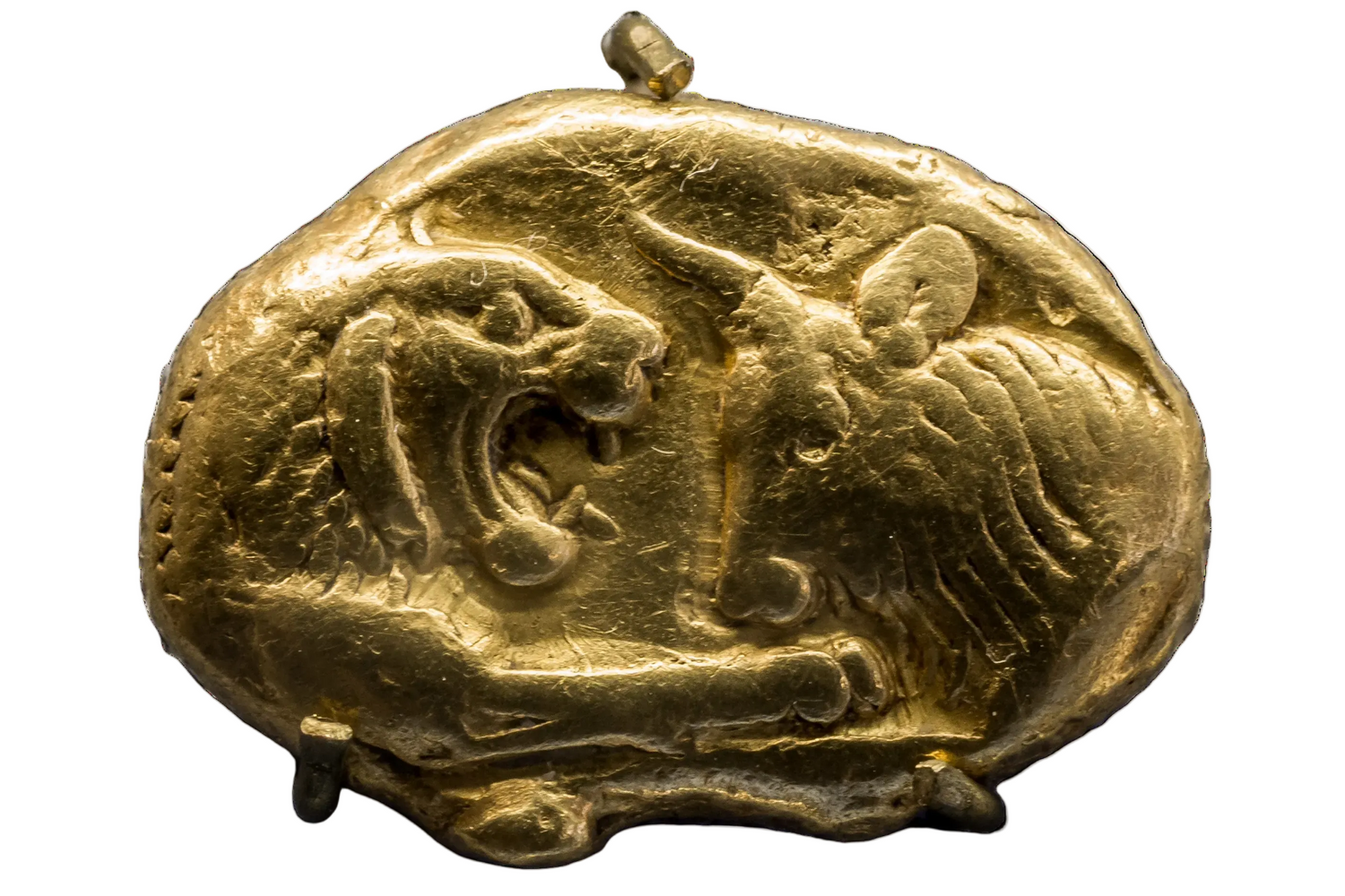 Gold coin with a design of a lion and a bull on a white background